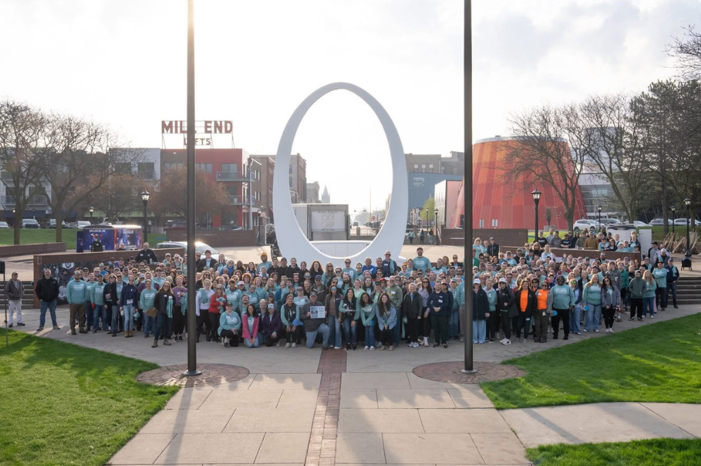 Large staff/community group picture outdoors