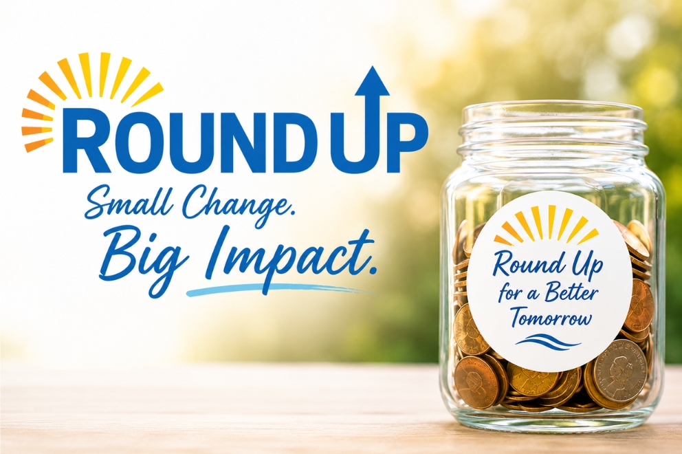 Round Up for a Better Tomorrow label on jar with coins inside. Small Change. Big Impact.